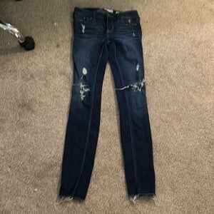 dark blue ripped skinny jeans